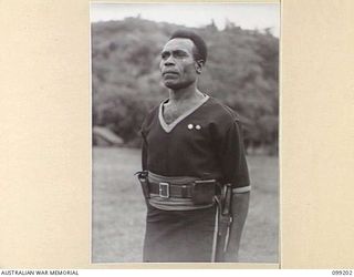 RABAUL, NEW BRITAIN, 1945-11-25. SERGEANT-MAJOR (FIRST CLASS) NIGOTAMI, WHO HAS HAD 26 YEARS SERVICE WITH THE ROYAL PAPUAN CONSTABULARY IN NEW GUINEA AND NEW BRITAIN. PHOTOGRAPHED DURING A PARADE ..