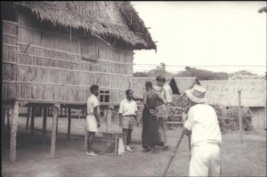 Jonathan Baloiloi and Adi'loi'i'nana. (Joe) Ia'ia'mina with mosquito trap and camera crew at Vunarima : Rabaul, New Britain, Papua New Guinea, 1960-1961 / Terence and Margaret Spencer