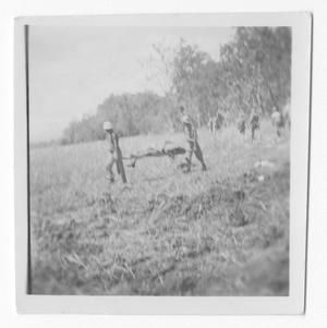 [Servicemen Carrying Serviceman on Stretcher on Guadalcanal]