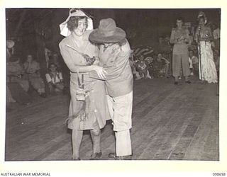 LAE, NEW GUINEA. 1945-11-08. PRIVATE V. KING AS MABEL AND PRIVATE M. MORGAN AS DAVE, WHO WERE JUDGED THE BEST HUMOUROUS PAIR DURING THE FANCY DRESS PARTY HELD BY MEMBERS OF AUSTRALIAN WOMEN'S ARMY ..