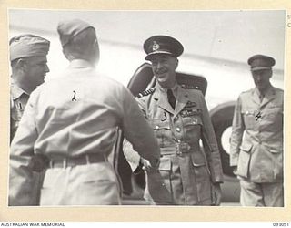 TOROKINA, BOUGAINVILLE, 1945-06-13. THE GOVERNOR GENERAL OF NEW ZEALAND, MARSHAL OF THE ROYAL AIR FORCE, SIR CYRIL L.N. NEWALL (3), STEPPING FROM THE PLANE ON HIS ARRIVAL AT PIVA AIRSTRIP FOR AN ..