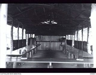 RABAUL, NEW BRITAIN, 1946-03-15. THE INTERIOR OF THE MESS HUT AT 5 GROUP CAMP. THE CAMP IS ONE OF THIRTEEN GROUP CAMPS ESTABLISHED AROUND RABAUL FOR THE CONCENTRATION OF JAPANESE PERSONNEL. ..