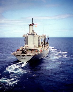 A starboard quarter view of the fleet oiler USS CIMARRON (AO 177) underway