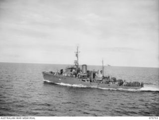 AT SEA. 1944-09/08. THE RAN CORVETTE, COLAC PROCEEDING AT FULL SPEED TO ATTEND TO AN ALARM WHILE ON CONVOY DUTY ALONG THE COAST OF NEW GUINEA