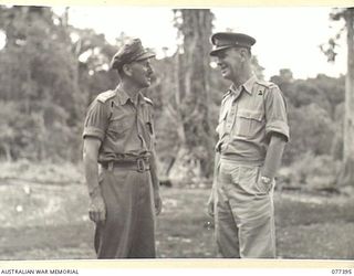 MALMAL VILLAGE, NEW BRITAIN. 1944-11-28. MAJOR-GENERAL WORDSWORTH, GENERAL OFFICER COMMANDING, 31ST INDIAN ARMOURED DIVISION (1), WHO IS TOURING THE BATTLE AREAS OF NEW GUINEA AND NEW BRITAIN ..