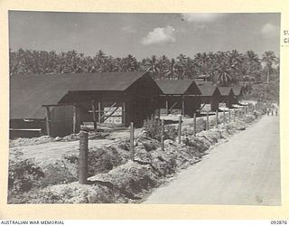 JACQUINOT AREA, NEW BRITAIN. 1945-06-09. RATION STORAGE SHEDS AT HEADQUARTERS 5 BASE SUB-AREA SITUATED APPROXIMATELY 50 YARDS FROM THE DOCK