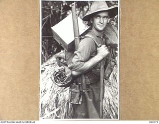 GUY'S POST, FARIA RIVER AREA, NEW GUINEA. 1943-11-08. NX7744 PRIVATE G. A. HANCOCK OF MURWILLUMBAH, NSW AND OF THE 2/33RD AUSTRALIAN INFANTRY BATTALION MOVING TO GUY'S POST TO RELIEVE MEMBERS OF ..