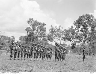 POM POM VALLEY, NEW GUINEA. 1943-11-27. CLOSE UP OF THE GUARD OF THE 2/10TH AUSTRALIAN INFANTRY BATTALION, CHAMPION GUARD OF THE 18TH AUSTRALIAN INFANTRY BRIGADE PARADING FOR THE TAKING OF A ..