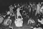 Marquesans at the village of Taiohae perform "Nuku Hiva" dance, with scientific crew from the Capricorn Expedition as audience