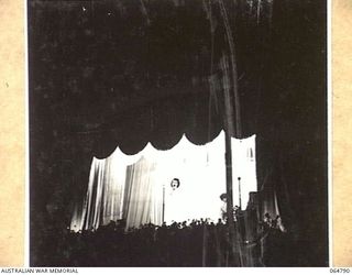 ELA BEACH, NEW GUINEA. 1943-12-21. MISS GLADYS MONCRIEFF, WHO CAME TO NEW GUINEA WITH A CONCERT PARTY SINGING TO THE TROOPS