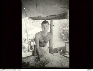 Oro Bay, New Guinea. 1943-04. A cook working in the kitchem at the 10th Field Ambulance, Australian Army Medical Corps