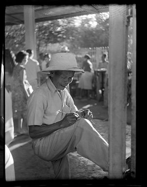 Market scene, elderly man writing, Papeete, Tahiti ,Papeete, Tahiti
