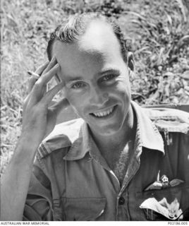 Goodenough Island, New Guinea. 1943. Portrait of Flight Lieutenant John Langley, an RAAF pilot, smoking a cigarette. (Donor: R. Curtis)