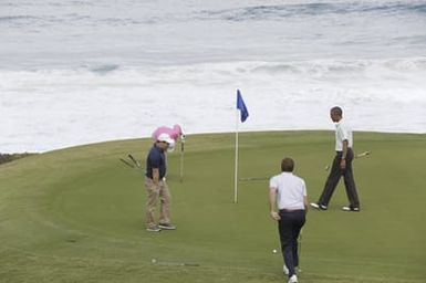 Barack Obama plays golf with Prime Minister Najib Razak, Joe Paulsen, and Mike Brush in Kaneohe Bay, Hawaii, December 24, 2014