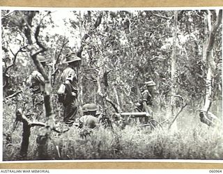 DONADABU AREA, NEW GUINEA. 1943-11-30. A VICKERS 303 MACHINE GUN CREW OF THE 2/10TH AUSTRALIAN INFANTRY BATTALION IN ACTION DURING A COMBINED EXERCISE WITH THE 2/4TH AUSTRALIAN FIELD REGIMENT. ..