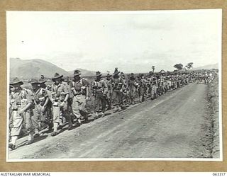 DUMPU, NEW GUINEA. 1944-01-03. TROOPS OF B COMPANY, 2/12TH INFANTRY BATTALION, 18TH AUSTRALIAN INFANTRY BRIGADE, WHO HAVE JUST ARRIVED BY AIRCRAFT FROM PORT MORESBY. IDENTIFIED PERSONNEL ARE: TX603 ..