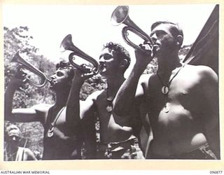 MATAPI CRATER, NEW BRITAIN, 1945-09-15. PTE W.G. KINDNESS (1); PTE D. MCCASKILL (2); AND PTE L. STRANGE (3); MEMBERS OF 37/52 INFANTRY BATTALION, USING JAPANESE BUGLES, ESPECIALLY POLISHED FOR THE ..