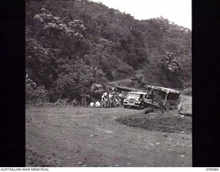 DONADABU, NEW GUINEA. 1943-10-07. HAIRPIN BEND NEAR DONADABU WHERE A TRUCK HAS JUST CRASHED DOWN A GORGE