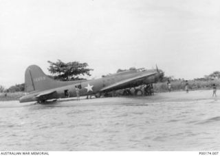 A "FLYING FORTRESS" NO. 12659 B17 BOMBER BOGGED IN THE SAND ON THE BEACH