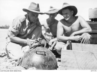 PALMALMAL PLANTATION, JACQUINOT BAY, NEW BRITAIN. 1944-11-24. NX130454 LIEUTENANT S.G. HARMER (1); NX164558 PRIVATE L.T. JOHNSON (2) AND VX140755 PRIVATE R.A. GRILLS (3); 17TH ADVANCED AMMUNITION ..