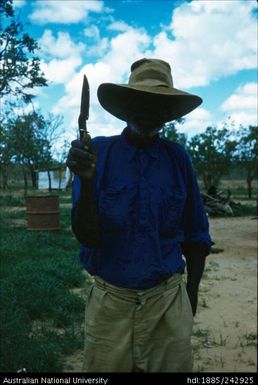 Aboriginal man holding a knife