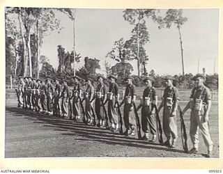 TOROKINA, BOUGAINVILLE, 1945-08-18. SPECIAL PARADE OF B CORPS SIGNALS WHICH WON BOTH THE LOCAL CRICKET AND AUSTRALIAN RULES FOOTBALL COMPETITIONS HELD IN 2 CORPS AREA. THE UNIT WAS INSPECTED BY ..