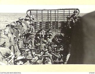 KELANOA, NEW GUINEA. 1944-01-24. TROOP TRAFFIC BETWEEN KELANOA AND SIO IS BY LANDING CRAFT MECHANIZED. THIS LANDING CRAFT MECHANIZED HAS EIGHTY MEN OF THE 30TH INFANTRY BATTALION AND THEIR ..