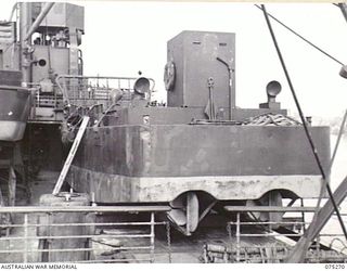 ALEXISHAFEN, NEW GUINEA. 1944-08-15. ONE OF THE MANY INVASION BARGES ON THE DECK OF THE RAN ASSAULT SHIP, "MANOORA"