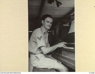 1943-04-05. NEW GUINEA. WITH THE AID OF AN OLD HAND PUMPED ORGAN CPL. CLIFTON JOHNS OF ALBERTON, S.A. HAS COMPOSED A NUMBER OF SONGS IN HIS SPARE TIME IN NEW GUINEA. HIS LATEST COMPOSITION ..