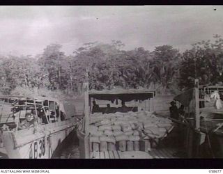 TERAPO, NEW GUINEA. 1943-09-16. LANDING CRAFT MECHANISED, LOADED WITH 15 TONS OF RATIONS AT THE WHARF