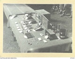 MILILAT, NEW GUINEA. 1944-08-13. SOME OF THE MANY AND VARIED ARTICLES ENTERED IN THE HOBBIES COMPETITION AND EXHIBITION AT HEADQUARTERS, 5TH DIVISION