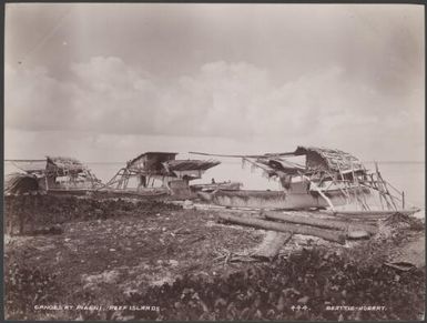 Three canoes on a beach at Pileni, Reef Islands, 1906 / J.W. Beattie