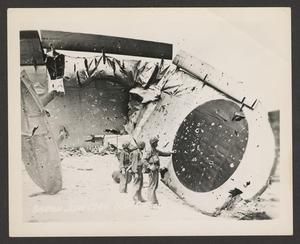 [United States Marines Inspecting Wrecked Japanese Kawanishi H8K on Saipan]