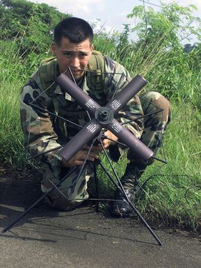 Lance Corporal Hugo Raul Sandoval a radio operator from 3rd Battalion, 7th Marines India Company, sets up an antenna for communications during an airfield seizure during Exercise KOA THUNDER 2001. KOA THUNDER is an exercise involving elements of 1ST Marine Air Wing (MAW), and 3rd Marine Division, where Marines conduct an Operational Readiness Exercise (ORE). The Aviation Support Element (ASE) from Kaneohe Bay, Hawaii, will be tested on command and control of several different missions, to include Tactical Recovery of Aircraft and Personal (TRAP), airfield seizures, and a Noncombatant Evacuation Operation (NEO)