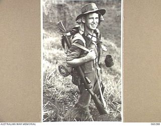 RAMU VALLEY AREA, NEW GUINEA. 1943-11-08. SX12327 PRIVATE T. C. REID OF THE 2/27TH AUSTRALIAN INFANTRY BATTALION