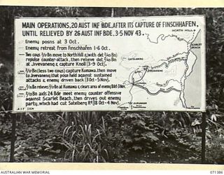 FINSCHHAFEN AREA, NEW GUINEA, 1944-03-20. ONE OF MANY BATTLE SIGNS IN THE FINSCHHAFEN AREA, THIS SIGN RECORDS THE ACTIVITIES OF THE 2/13TH, 2/15TH, 2/17TH AND 2/43RD INFANTRY BATTALIONS IN MAIN ..