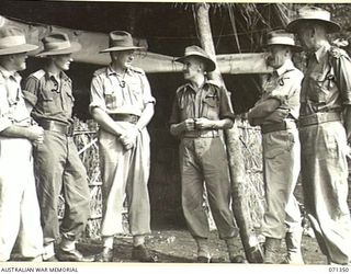 KILIGIA, NEW GUINEA, 1944-03-16. VX27 MAJOR-GENERAL A.H. RAMSAY, CBE, DSO, ED, (1), GOC HEADQUARTERS, 5TH DIVISION, WITH HIS SENIOR OFFICERS. IDENTIFIED PERSONNEL ARE: VX55002 LIEUTENANT G.H. ..