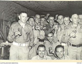 LAE, NEW GUINEA. 1944-09-25. HAPPY NCOS AT THE OFFICIAL OPENING OF NO. 1 SERGEANTS' MESS, HEADQUARTERS NEW GUINEA FORCE. THE OPENING WAS ATTENDED BY THE GOC NEW GUINEA FORCE, LIEUTENANT GENERAL ..