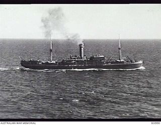 1941-09-17. AERIAL STARBOARD SIDE VIEW OF THE DUTCH CARGO STEAMER SWARTENHONDT WHICH CARRIED AUSTRALIAN TROOPS TO NEW GUINEA IN 1942 AND WAS INVOLVED IN OPERATION LILLIPUT IN EASTERN NEW GUINEA ..