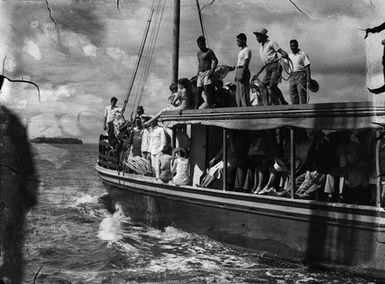 [View of a crowded passenger boat on the water]