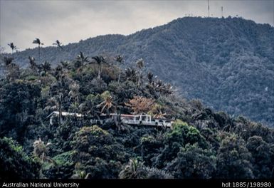 American Samoa - view of a house surrounded by forest