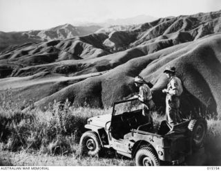 1943-06-29. NEW GUINEA. WAU-MUBO AREA. TYPICAL COUNTRY IN THE WAU-MUBO AREA. (NEGATIVE BY G. SHORT)