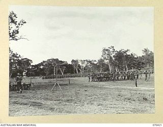 POM POM VALLEY, NEW GUINEA, 1944-02-16. NX8 LIEUTENANT-GENERAL SIR LESLIE J. MORSHEAD, KCB., KBE., CMG., DSO., ED., (1) GENERAL OFFICER COMMANDING NEW GUINEA FORCE, TAKES THE SALUTE AT THE FAREWELL ..
