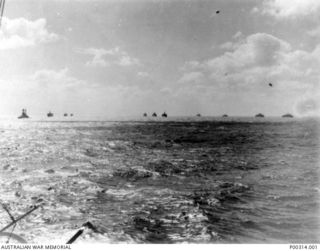 SOLOMON ISLANDS. 1935-45. HMAS CANBERRA LAYING A SMOKE SCREEN