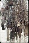 Fishing: nets with hand-carved wooden floats, some shaped like small fish