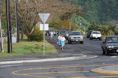 Earthquake ^ Flooding ^ Tsunami - Pago Pago, American Samoa, October 15, 2009 -- Several students join the morning rush hour in American Samoa as they walk to school. American Samoan public schools can be eligible for funding to repair damage caused by the earthquake, tsunami and flooding disaster under the Federal Emergency Management Agency's Public Assistance program. FEMA/Casey Deshong