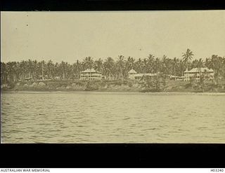 Herbertshohe, New Britain. c. 1914. A waterfront view of some of the houses. Peace was signed in the area. This town was later renamed Kokopo. (Donor J.J. Cummins)