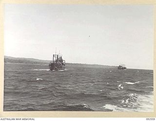BOUGAINVILLE. 1945-05-25. AUSTRALIAN ARMY SMALL SHIPS MOVING UP THE COAST OF THE NORTH SOLOMONS CARRYING TROOPS OF 31/51 INFANTRY BATTALION. THE MEN WERE LATER LANDED AT SORAKEN PENINSULA BY 42 ..