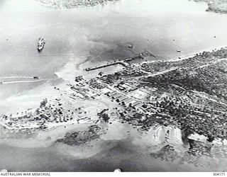 LOS NEGROS ISLAND, ADMIRALTY ISLANDS. 1944-06-12. AERIAL VIEW OF AN AMERICAN SEAPLANE BASE BEING DEVELOPED. IN THE CENTRE OF THE PHOTOGRAPH A LARGE WHARF IS UNDER CONSTRUCTION. TO ITS LEFT WORK IS ..