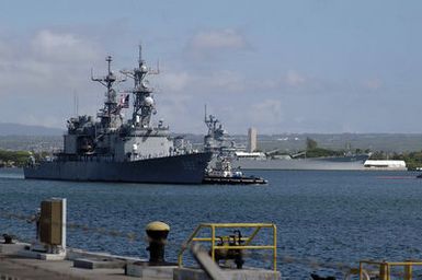 040525-N-6775N-029 (May 25, 2004)The US Navy (USN) Spruance Class Destroyer USS FLETCHER (DD 992) (foreground) returns to Naval Station (NS) Pearl Harbor, Hawaii (HI), after an 18-month"Sea Swap"experiment in support of Operation IRAQI FREEDOM, with the help of a commercial tug boat. A"Sea Swap"involves swapping out an entire crew every five months. The USS MISSOURI (BB 63) Memorial can be seen in the background right.U.S. Navy official photo by Photographer's Mate Second Class Justin P. Nesbitt (RELEASED)